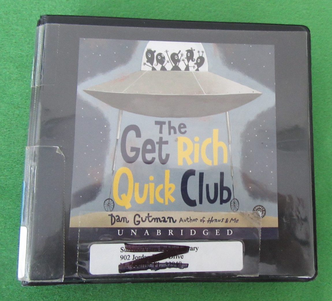 AUDIOBOOK ON 2 CDs THE GET RICH QUICK CLUB BY DAN GUTMAN — 2004; UNABR; EX-LIB