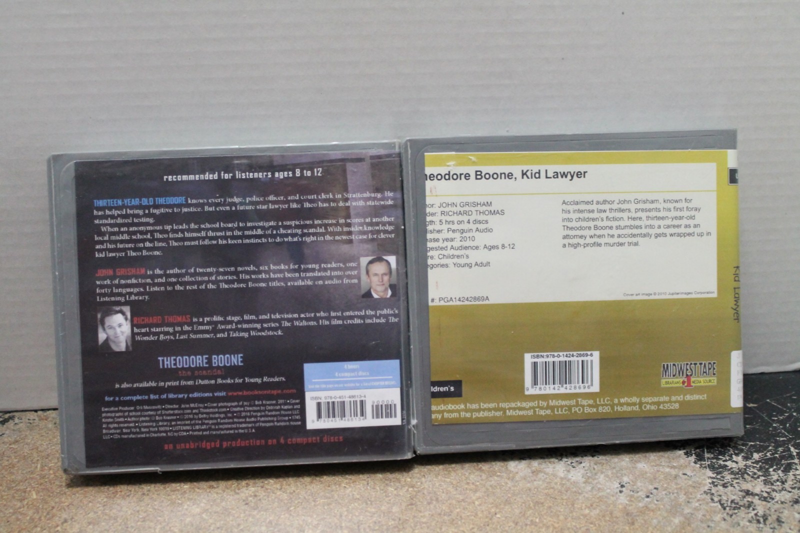 2 John Grisham/Theodore Boone audiobook CDs—Kid Lawyer & The Scandal