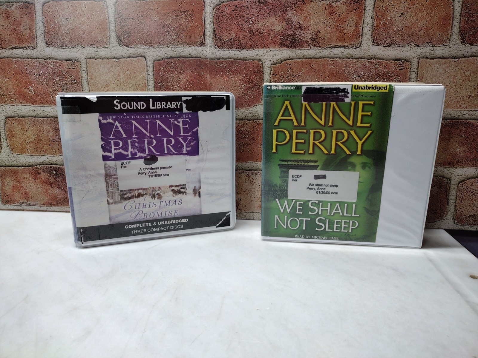 Lot of 2 -Anne Perry Audiobooks- Ex-Library-We Shall Not Sleep/Christmas Promise